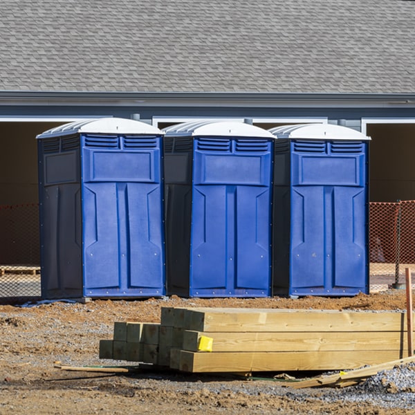 what is the cost difference between standard and deluxe porta potty rentals in Arcadia Michigan